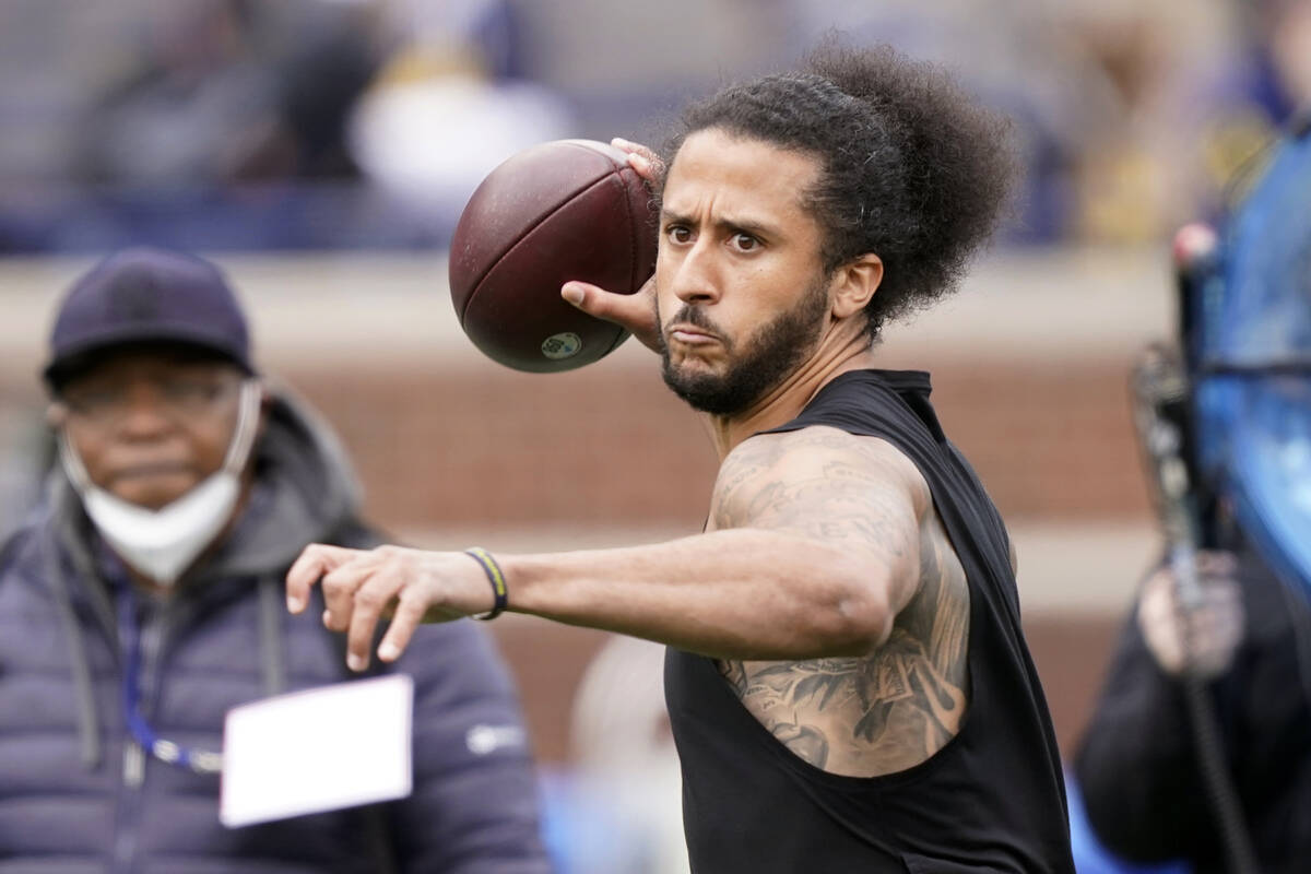 Quarterback Colin Kaepernick throws during halftime of an NCAA college football intrasquad spri ...