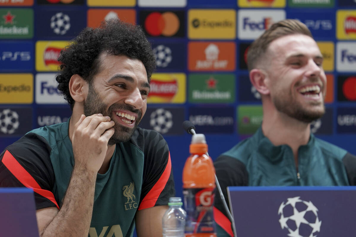 Liverpool's Mohamed Salah, left, and Liverpool's Jordan Henderson address the media during a pr ...