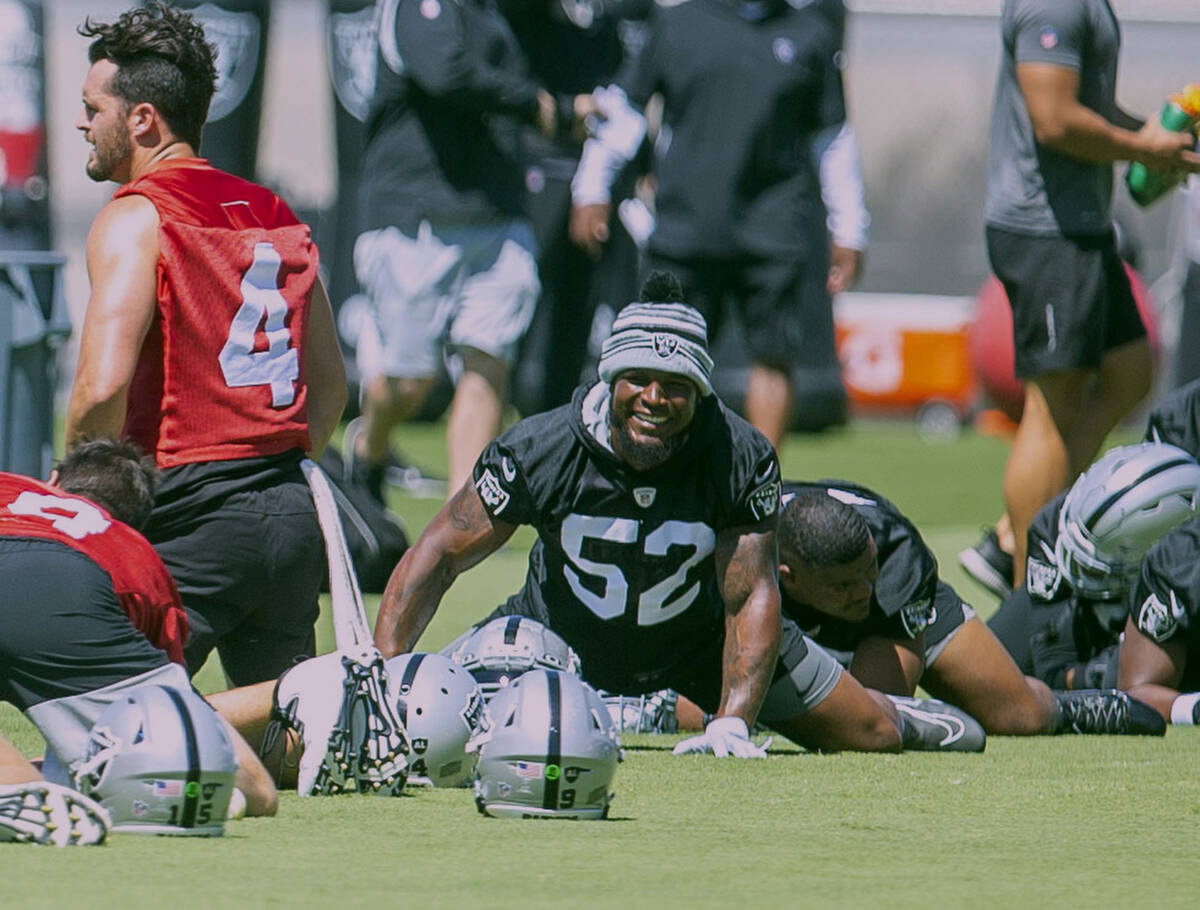 Raiders linebacker Denzel Perryman (52) smiles while stretching during practice on Thursday, Ma ...