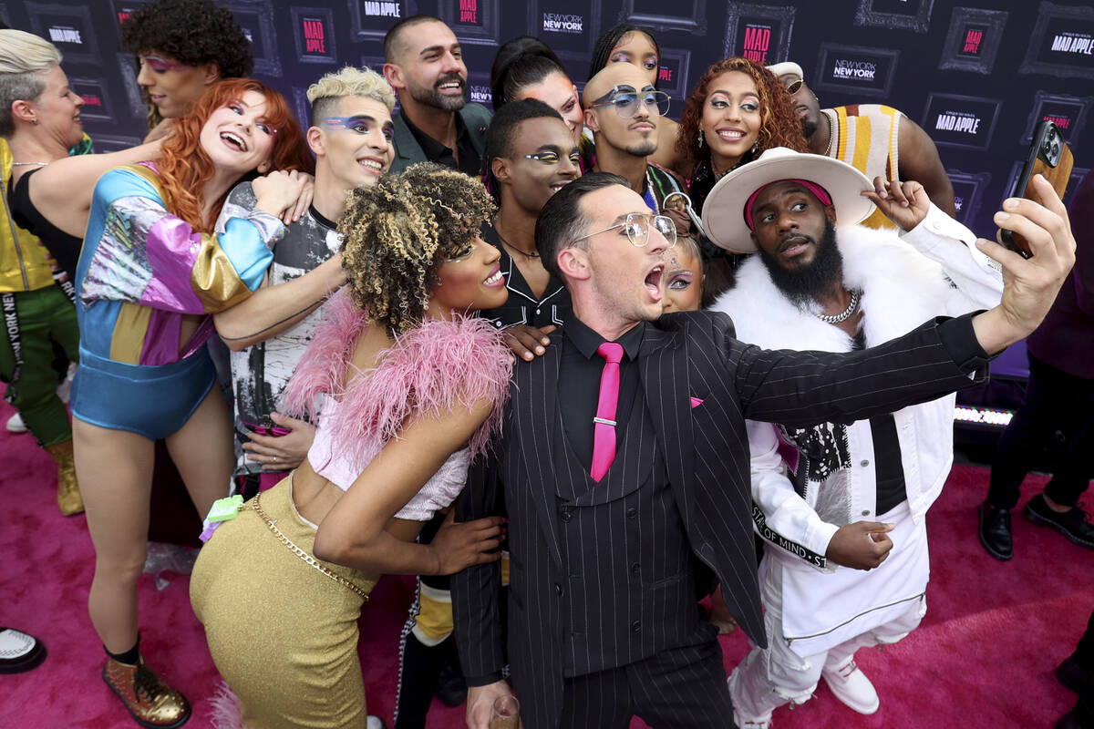 Paul Dabek takes a selfie with fellow cast members on the “pink carpet” for for t ...