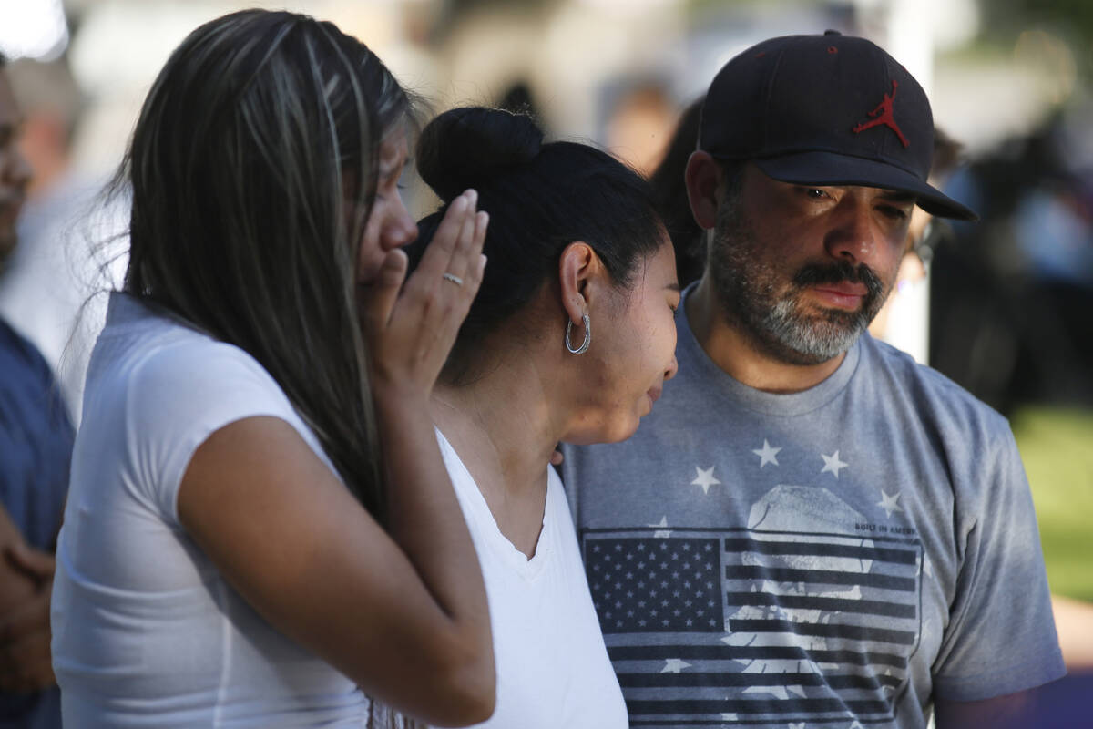 Mario Games, right, and his wife, Marisela and daughter Emily, react as they stand in front of ...