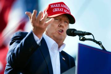 Former President Donald Trump speaks from the podium during a campaign rally, on May 1, 2022, i ...