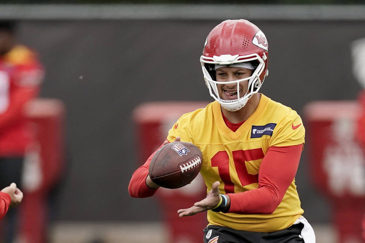 Kansas City Chiefs quarterback Patrick Mahomes catches a ball during the NFL football team's or ...