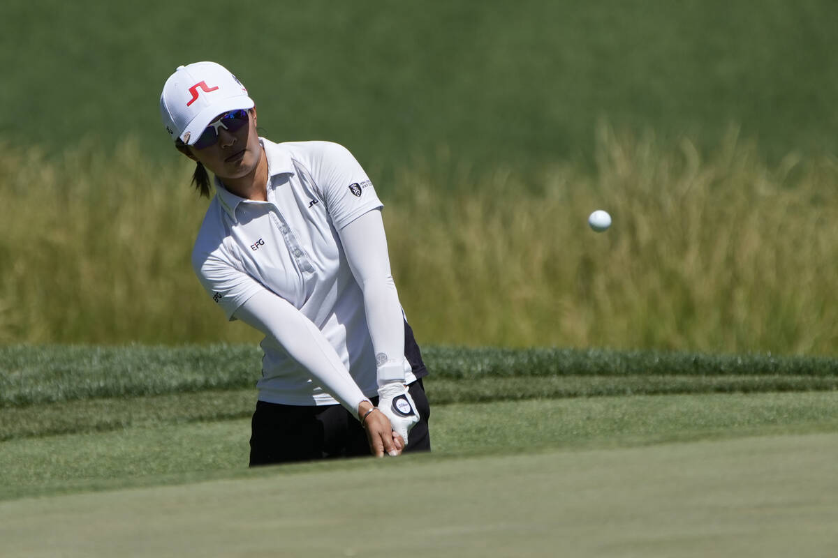 Tiffany Chan chips onto the second green during the third day of round-robin play in the LPGA B ...