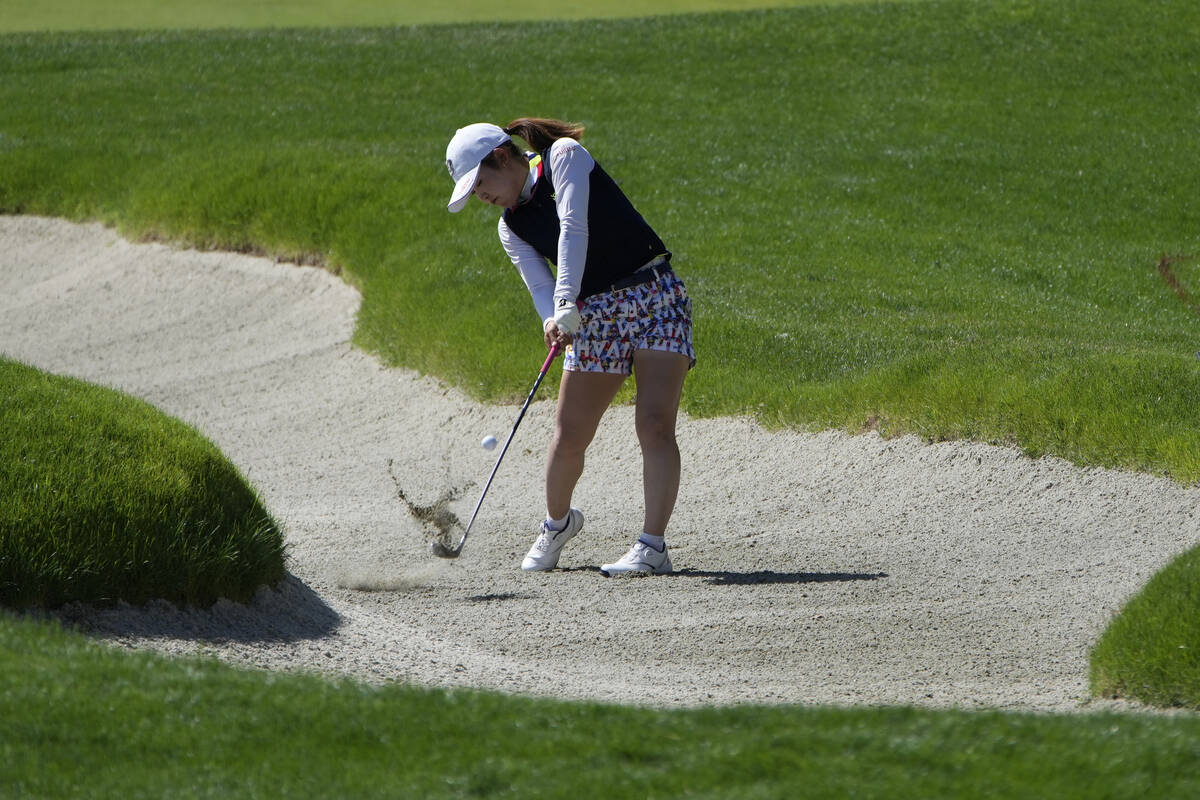 Ayaka Furue hits from a bunker on the first hole during the third day of round-robin play in th ...