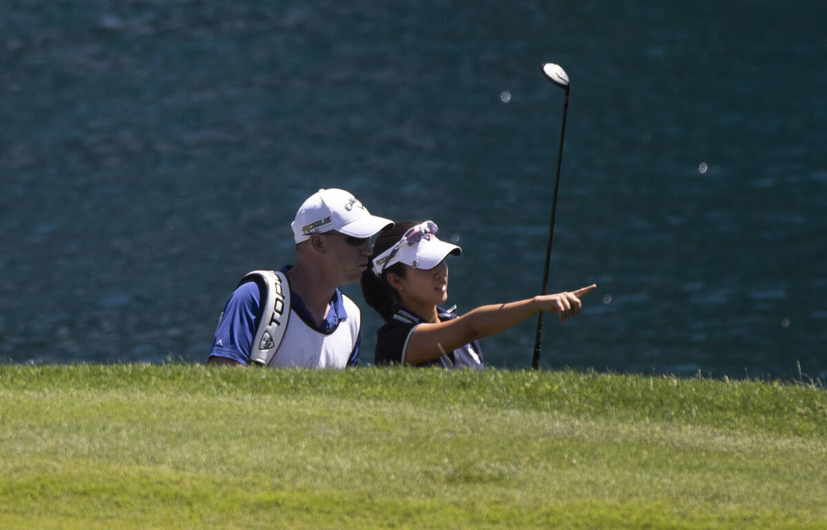 Andrea Lee, right, consults with her caddy during the final day of the LPGA Bank of Hope Match ...