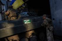 Ukrainian servicemen park a Russian BMP-2, an infantry combat vehicle, in the Kharkiv area, eas ...