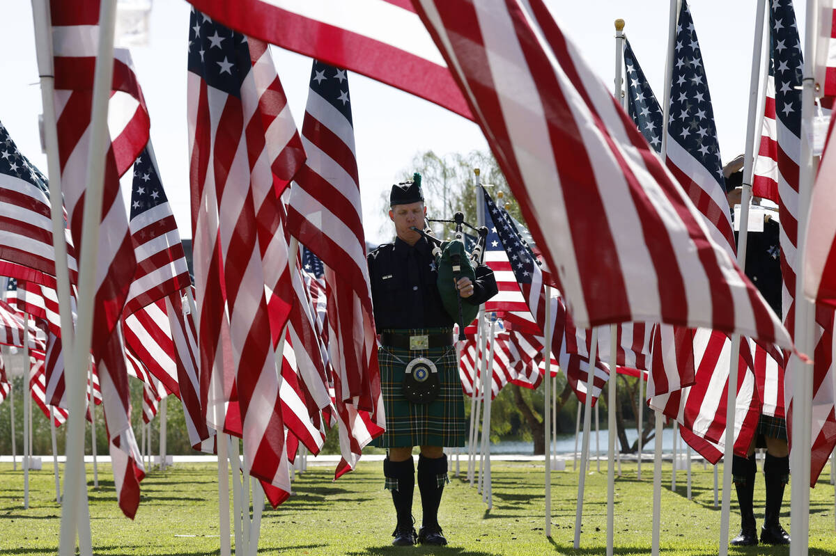 Las Vegas Emerald Society Police and Fire member Zane Simpson plays the bagpipes, Monday, May 3 ...