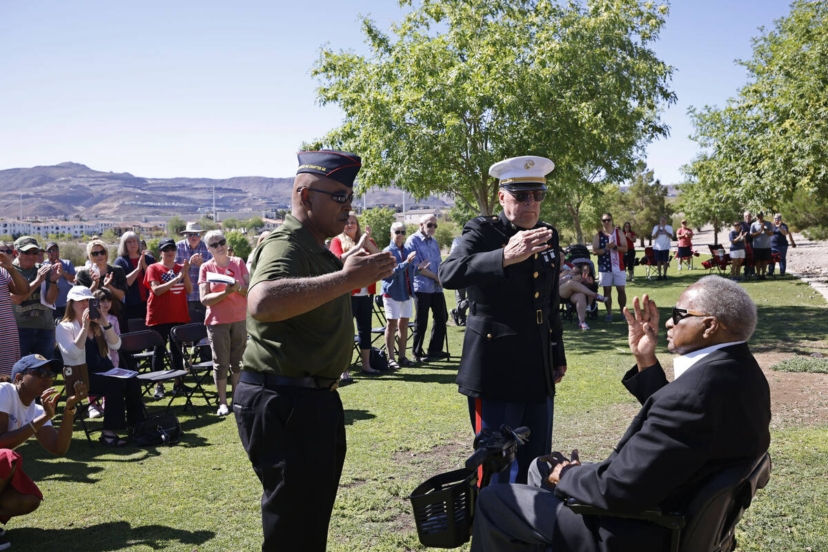 U.S. Marine Corps/U.S. Navy veteran Gary White, left, and U.S. Marine Veteran Dave Jochman, cen ...