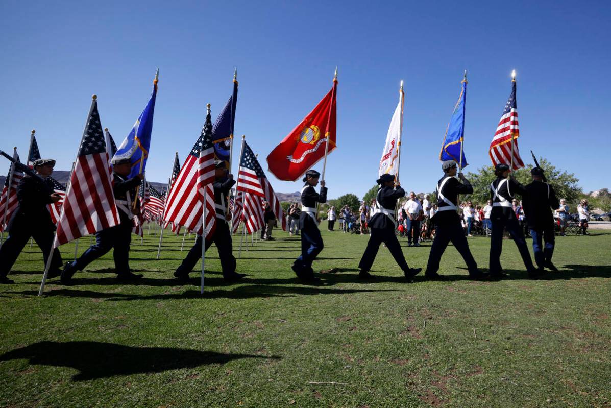 Member of Silverado High School JROTC march at Cornerstone Park in Henderson, Monday, May 30, ...