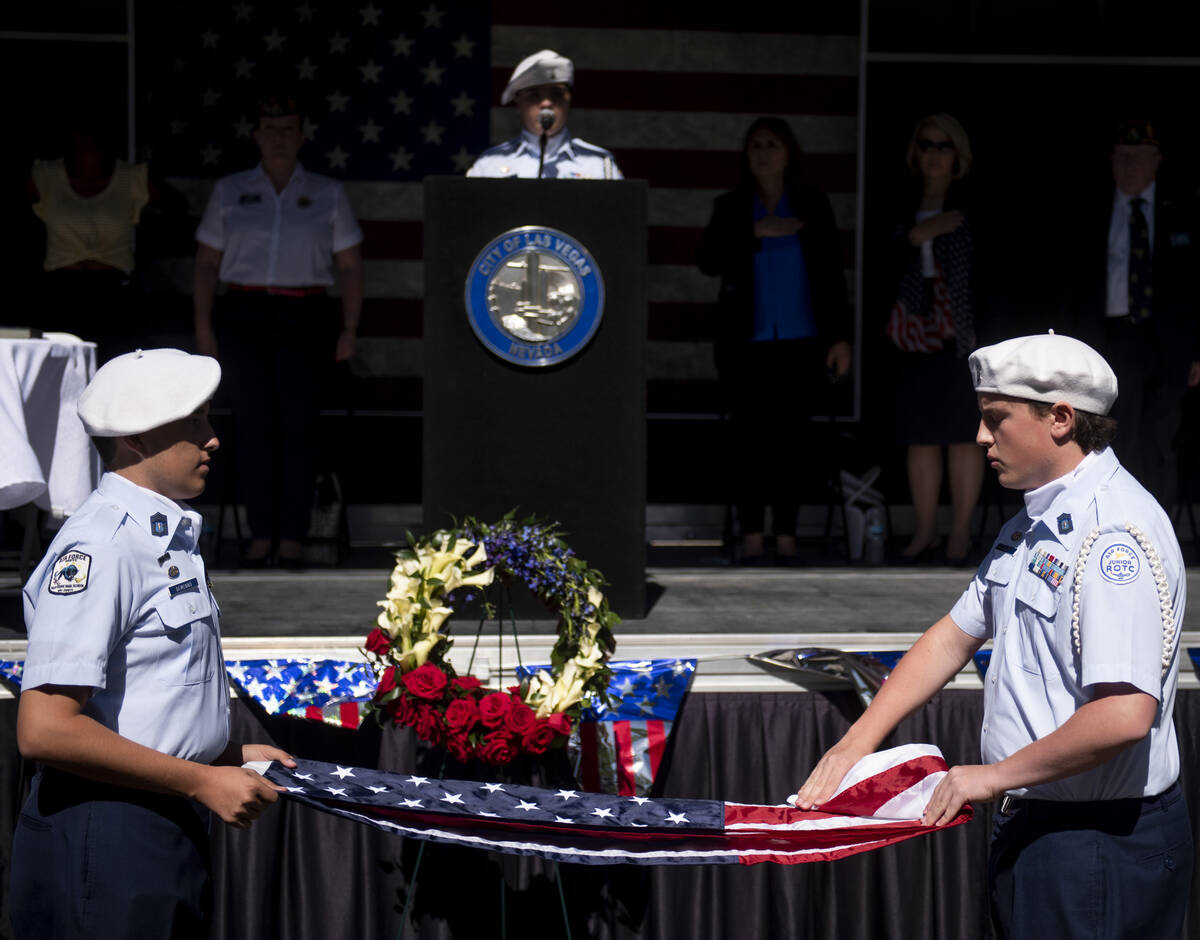 Mark DeMenno, left, and Steven Gillum, right, of the Palo Verde Air Force JROTC Honor Guard, pa ...