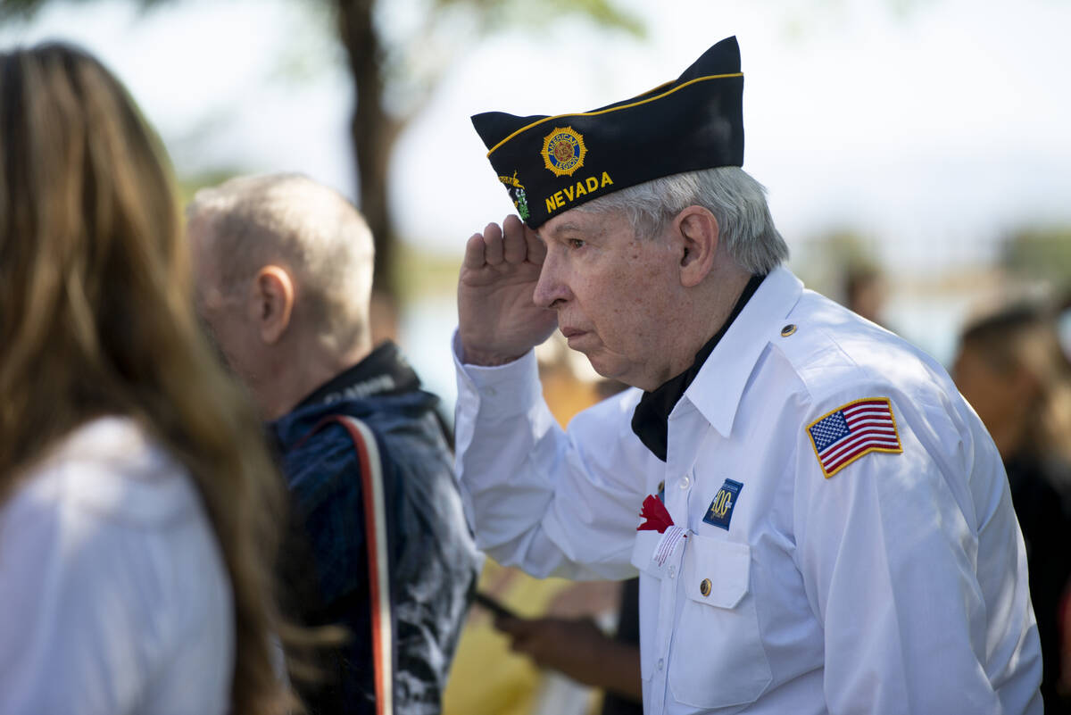 Army veteran Gary Parriott gives a salute during the 20th annual Memorial Day celebration at La ...
