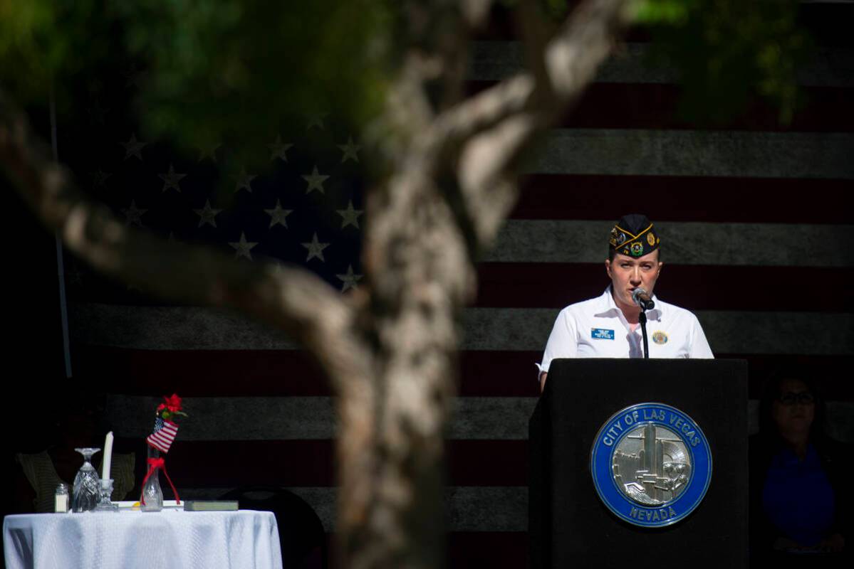 Pranava Moody, commander of American Legion Post 76, speaks to the crowd at Lake Sahara South P ...