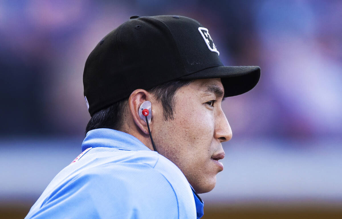 Home plate umpire Takahito Matsuda wears the ear piece connected to the Automated Ball-Strike ...