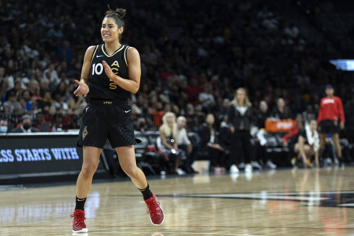 Las Vegas Aces guard Kelsey Plum (10) claps for her team during the second half of a WNBA baske ...