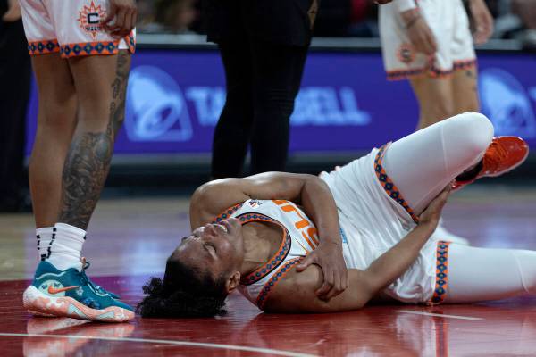 Connecticut Sun forward Alyssa Thomas (25) grimaces in pain after falling to the court during t ...