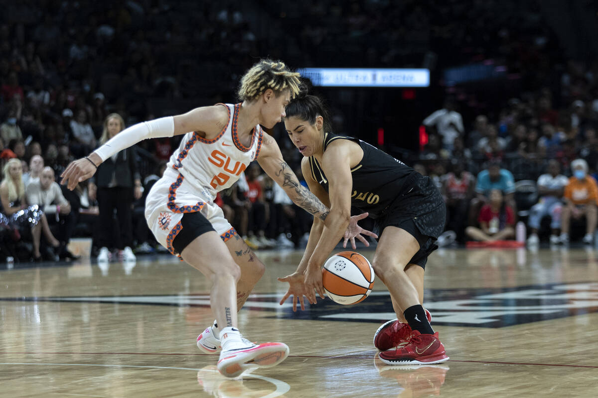 Las Vegas Aces guard Kelsey Plum (10) loses control of the ball to Connecticut Sun guard Natish ...