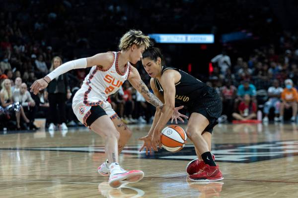 Las Vegas Aces guard Kelsey Plum (10) loses control of the ball to Connecticut Sun guard Natish ...