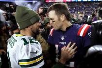 Green Bay Packers quarterback Aaron Rodgers, left, and New England Patriots quarterback Tom Bra ...