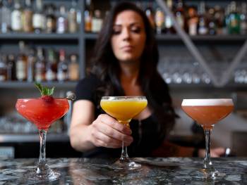 Above, lead bartender Erin Hall creates specialty cocktails with homemade syrups. (Ellen Schmi ...
