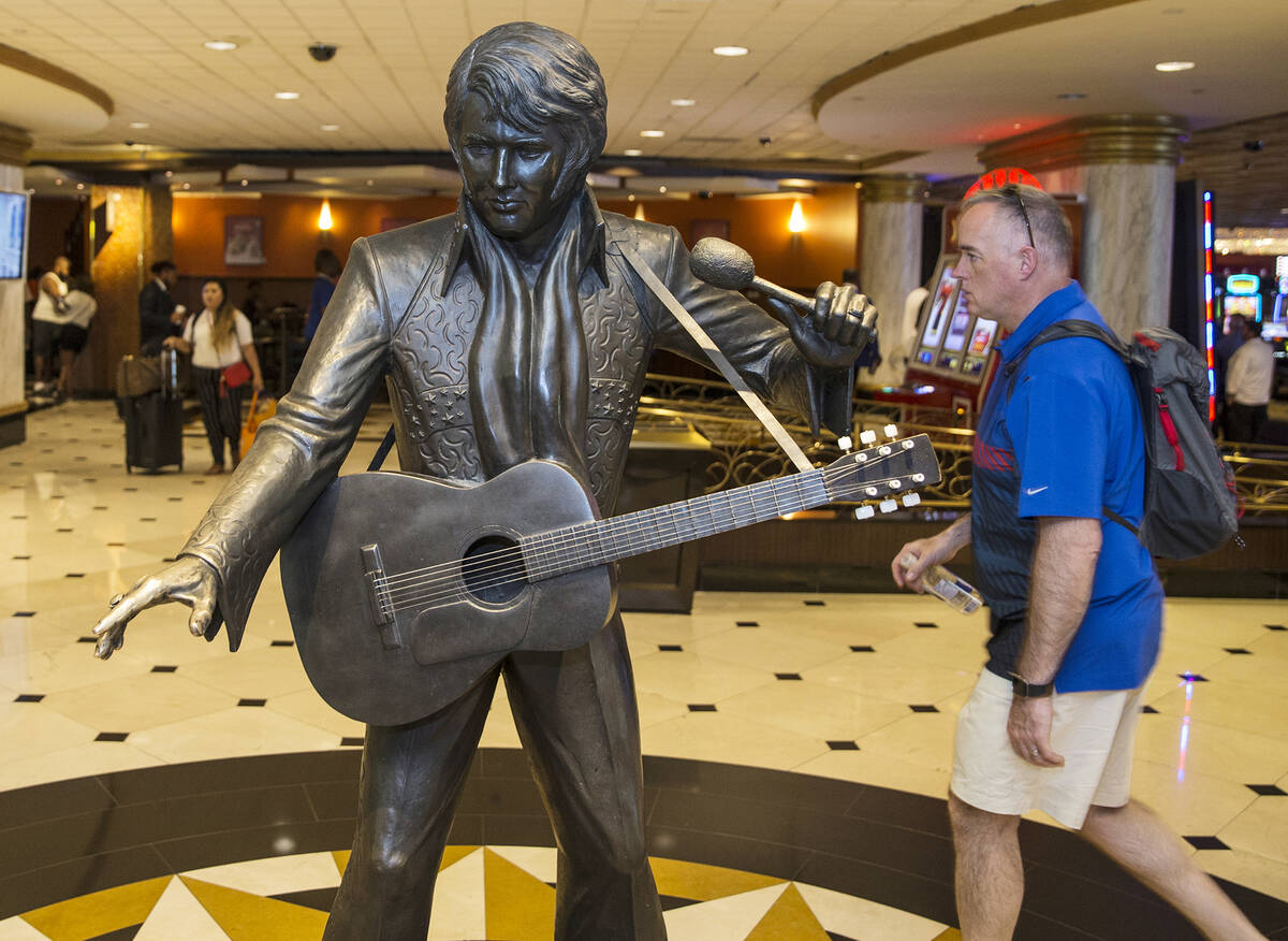 Guests pass by an Elvis Presley statue in the lobby of the Westgate on Thursday, July 11, 2019, ...