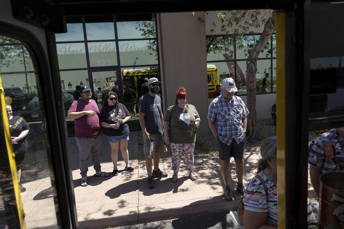 Patrons wait in line for Izzy’s Pizza Bus outside Vegas Valley Winery on Saturday, May 2 ...