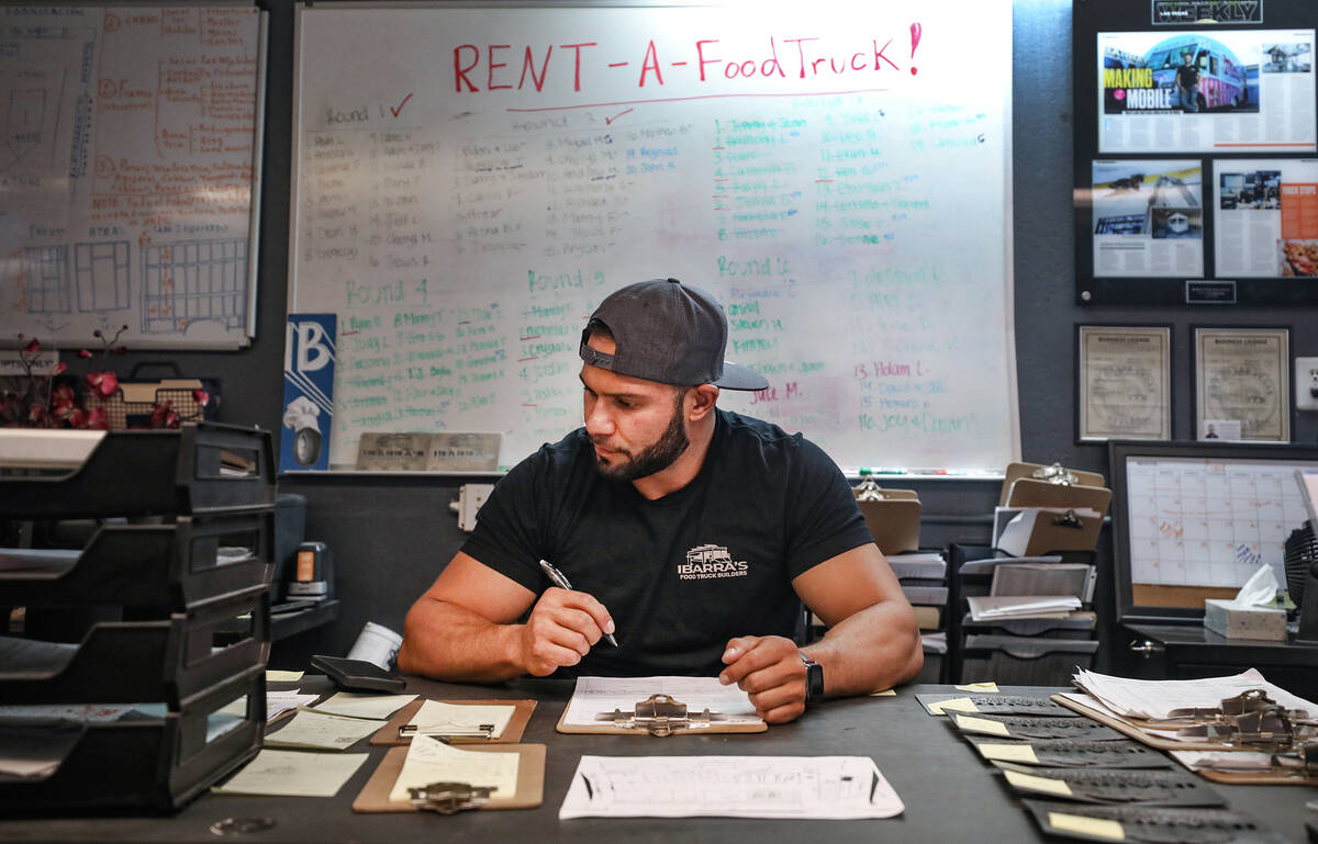 Jonathan Ibarra, co-owner of Ibarra’s, a food truck building and renting business, works ...