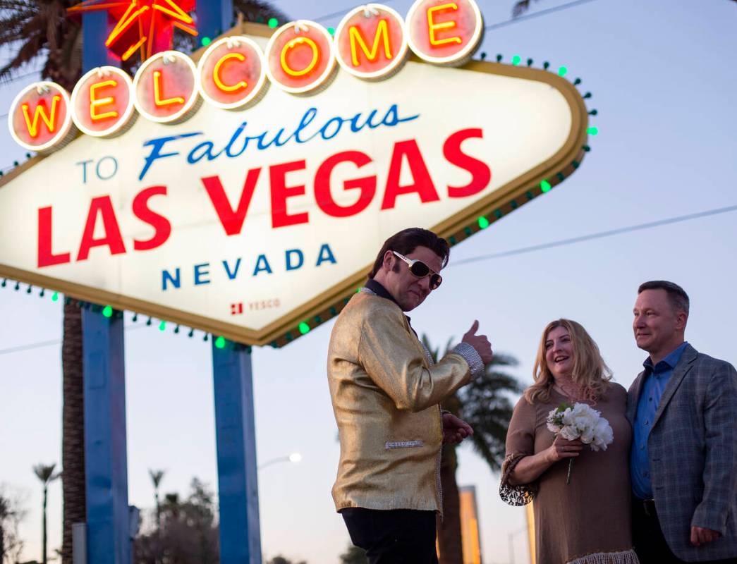 Amanda Anderson and Alan Anderson have their vows renewed by an Elvis impersonator at the Welco ...