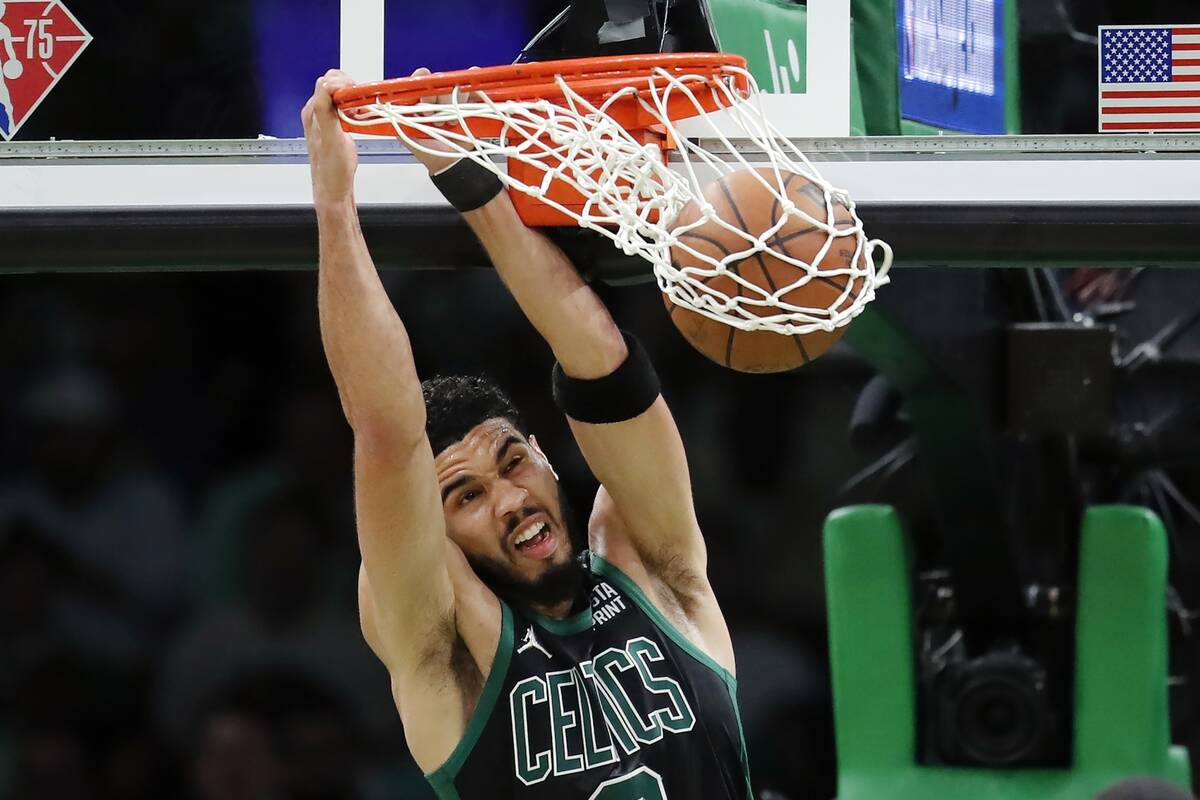 Boston Celtics' Jayson Tatum dunks against the Miami Heat during the first half of Game 6 of th ...