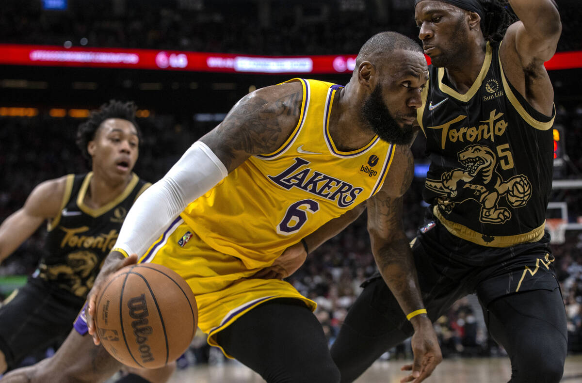 Los Angeles Lakers LeBron James (6) drives at Toronto Raptors Precious Achiuwa during the secon ...