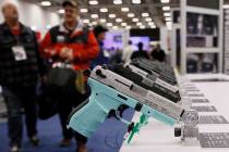 Handguns are on display at the NRA convention in Dallas in May 2018. (AP Photo/Sue Ogrocki)