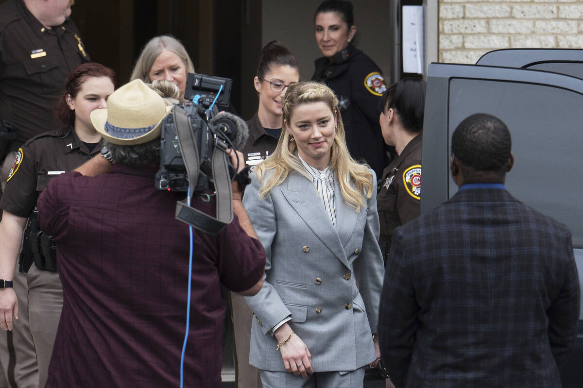 Actress Amber Heard departs the Fairfax County Courthouse Friday, May 27, 2022 in Fairfax, Va. ...