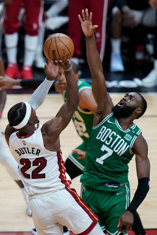 Boston Celtics guard Jaylen Brown (7) defends Miami Heat forward Jimmy Butler (22) during the s ...