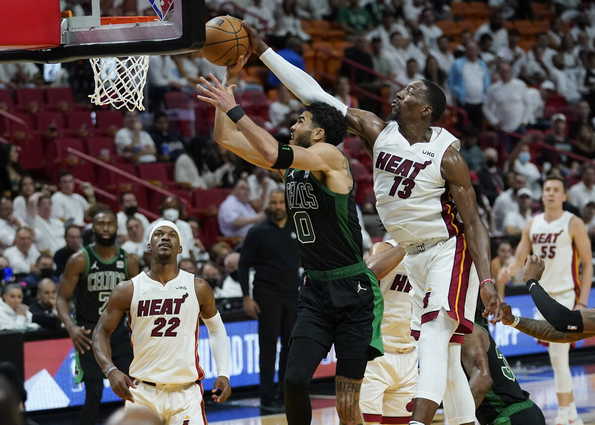 Miami Heat center Bam Adebayo (13) blocks a shot to the basket by Boston Celtics forward Jayson ...