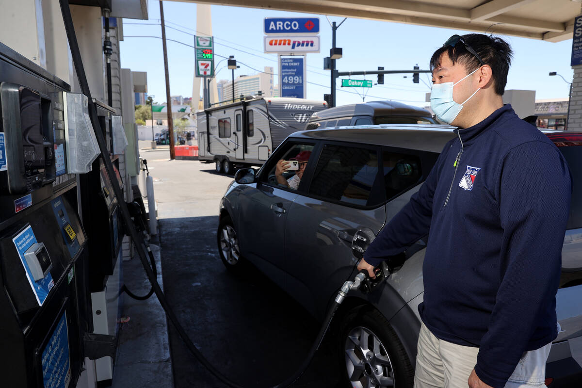 Bell Chen of New York fills up at a gas station on Las Vegas Boulevard at Oakey Boulevard in La ...