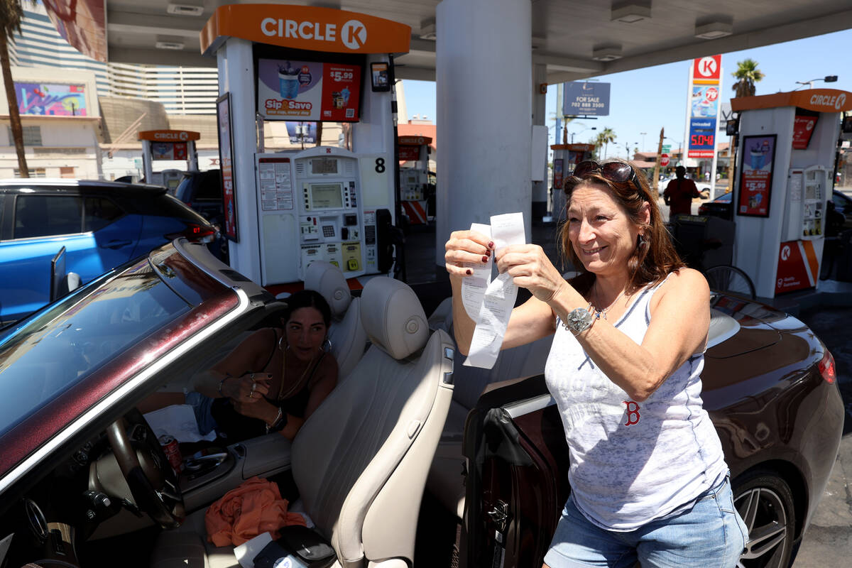 Gail Ruscito of Boston shows her receipts from filling up a rental car at a gas station on Las ...