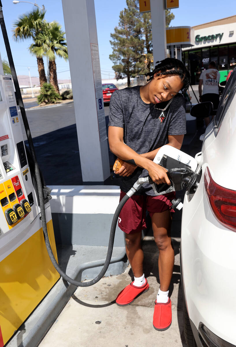 Aisha Sheppard of Las Vegas fills up at a gas station on Las Vegas Boulevard at Four Seasons Dr ...