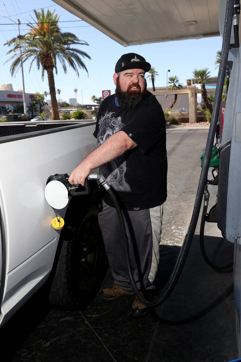 Aaron Miller of Las Vegas fills up his truck at a gas station on Flamingo Road at Maryland Park ...