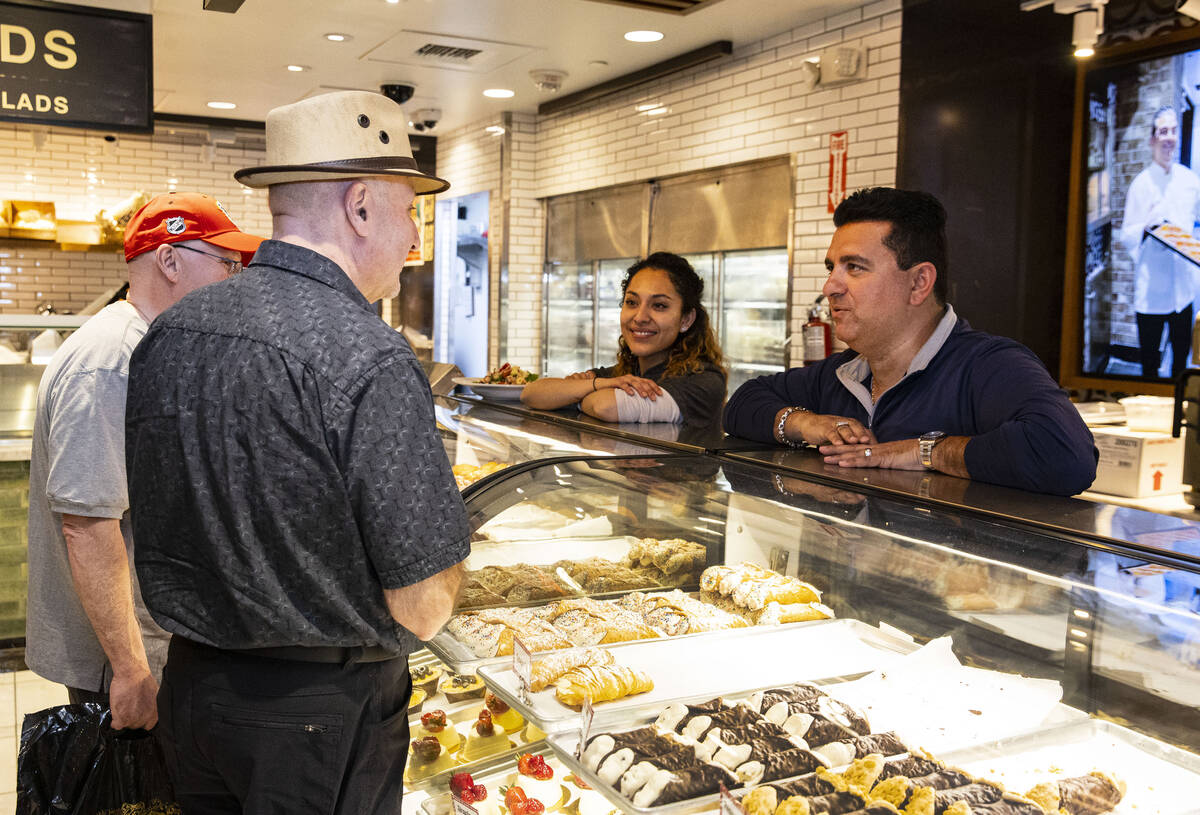 TLC's Cake Boss, Buddy Valastro, right, talks to his customers at his Boss Cafe at the LINQ hot ...