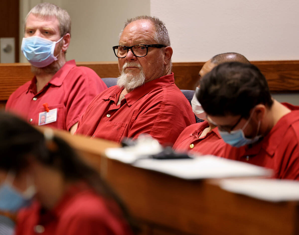 Richard Devries, 66, second from left, makes his initial court appearance in Henderson Justice ...