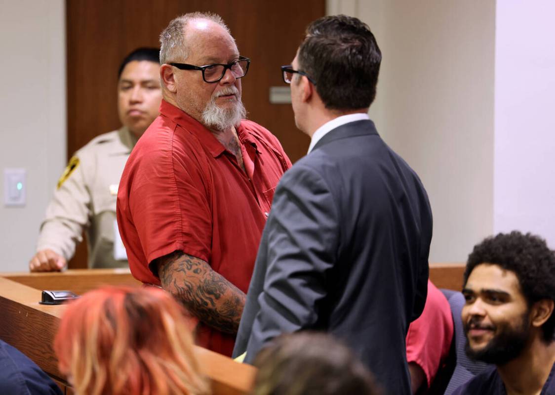 Richard Devries, 66, talks to his attorney Robert DeMarco during his initial court appearance i ...