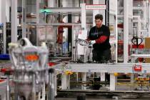 Teakgro Ventra assembles a drive unit at the Tesla Gigafactory, east of Reno, Nev., on Tuesday, ...