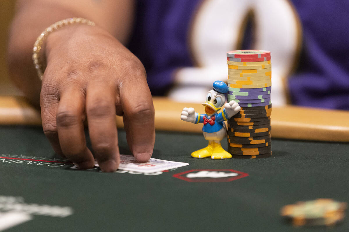 Darrius Brown of Massachusetts display his lucky charm during the World Series of Poker "H ...