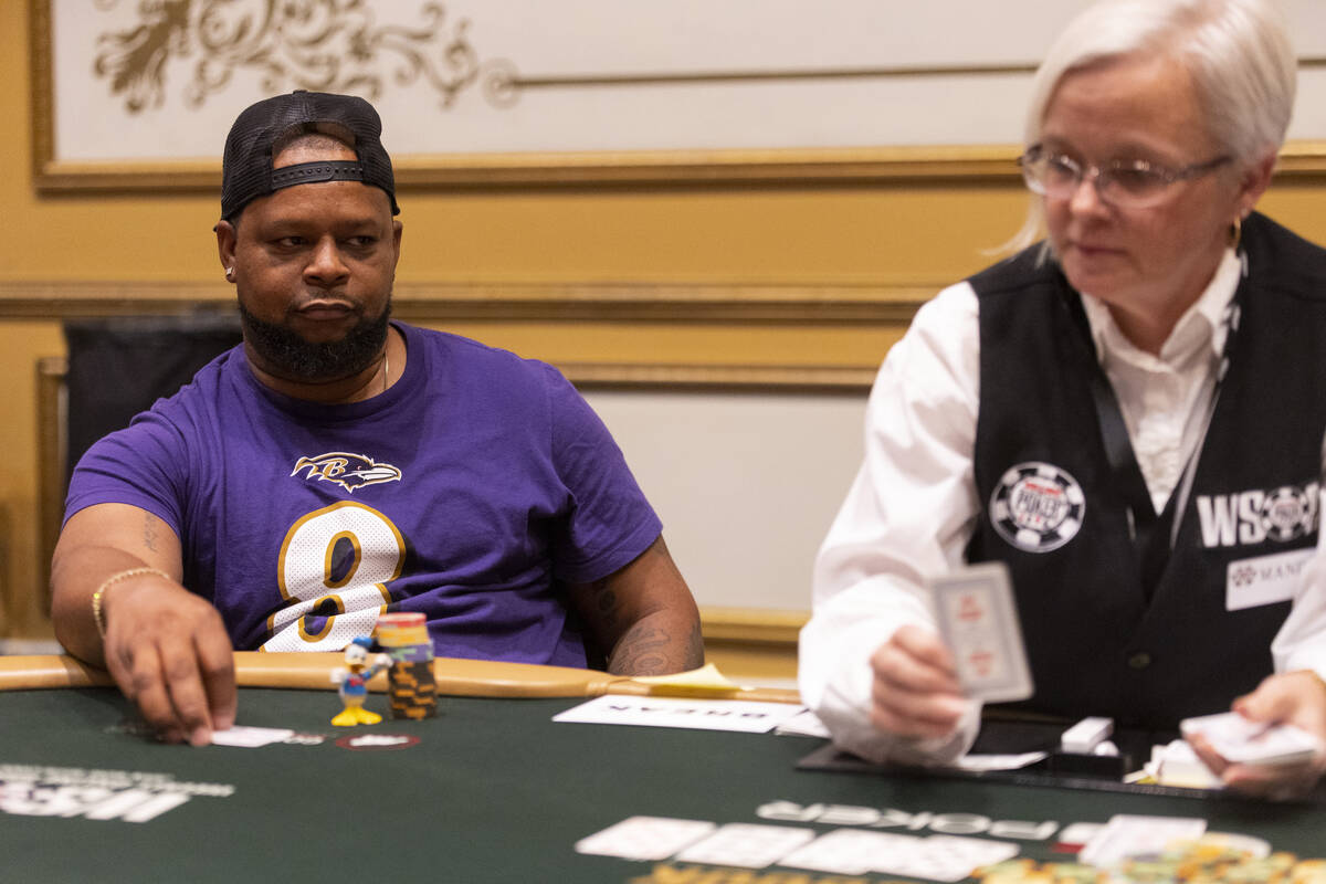 Darrius Brown of Massachusetts, left, waits to see the next card while participating in the Wor ...