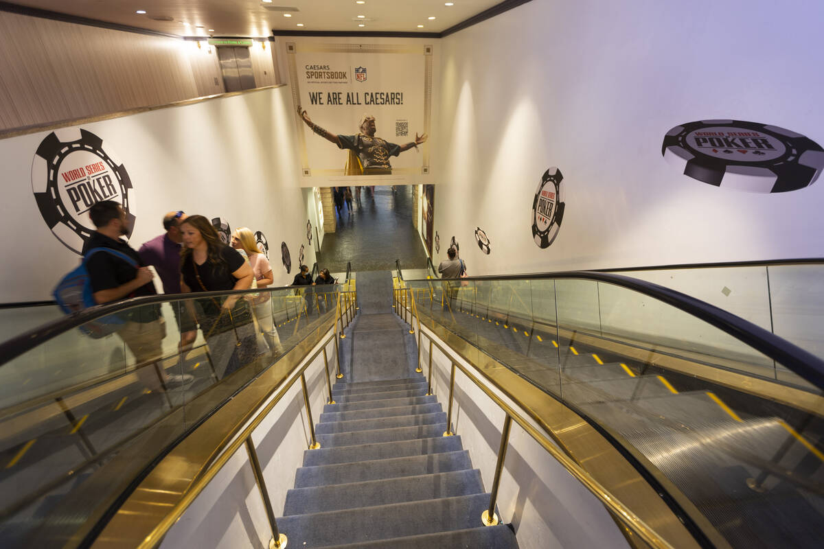 World Series of Poker signs decorate the stairway leading to the event at Paris Las Vegas hotel ...