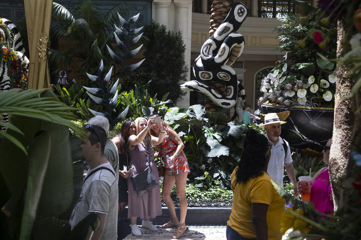 People visit the Bellagio’s Conservatory & Botanical Gardens in Las Vegas, Thursday, June 2, ...