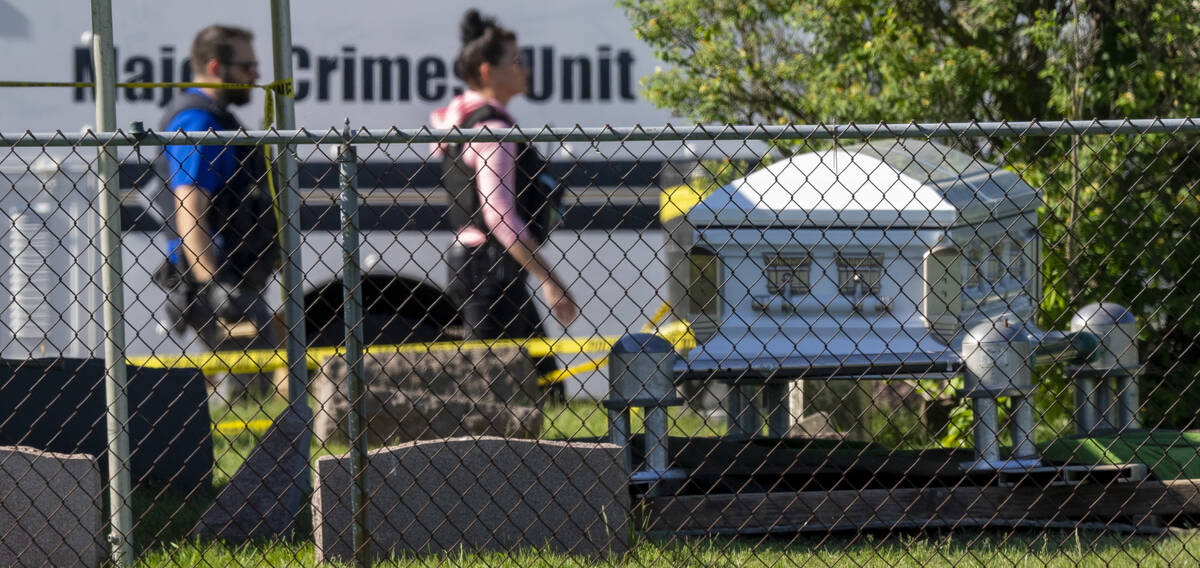 Law enforcement personnel work at the scene of a shooting Thursday, June 2, 2022 at Graceland C ...