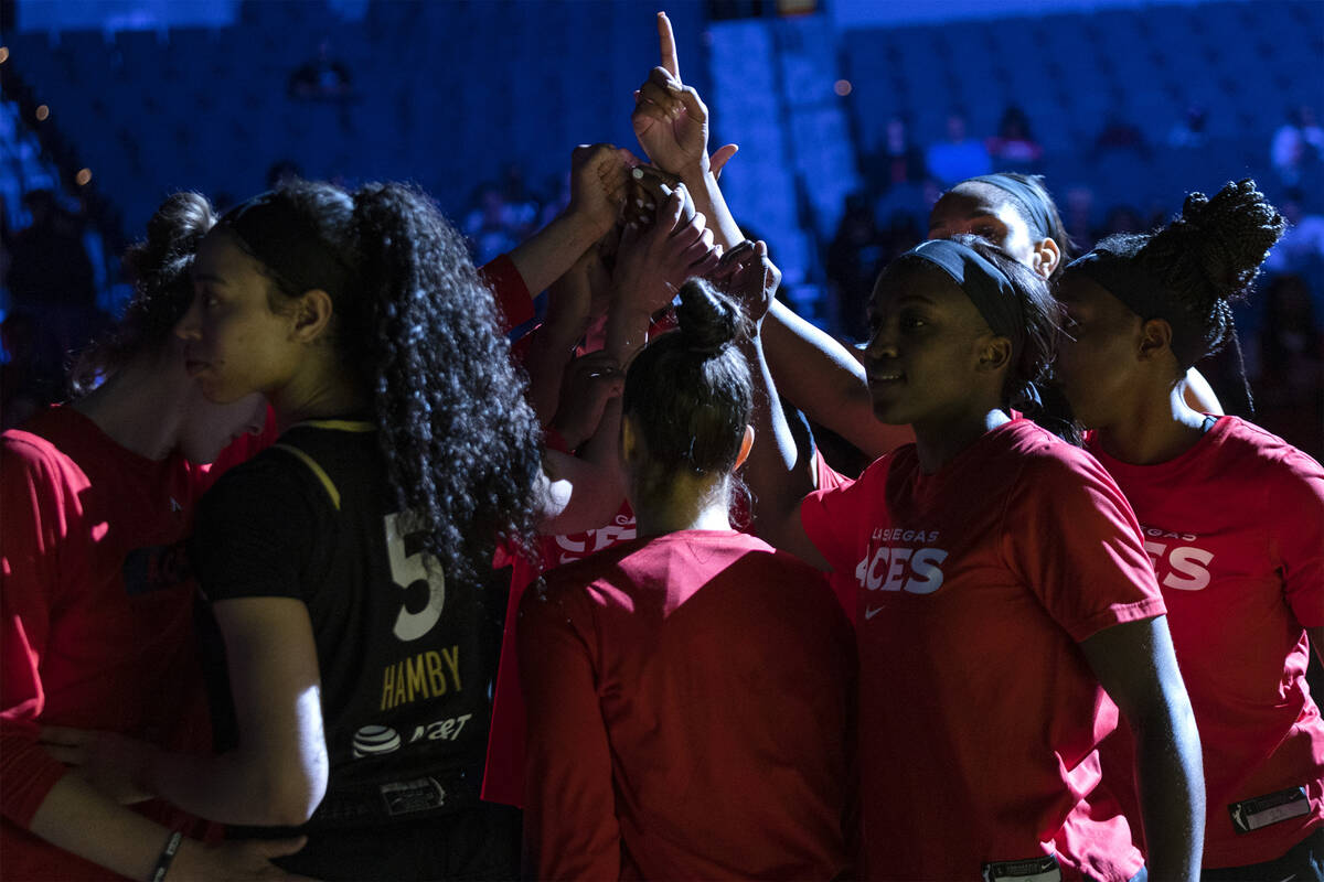 The Las Vegas Aces put their hands together before a WNBA basketball game against the Connectic ...