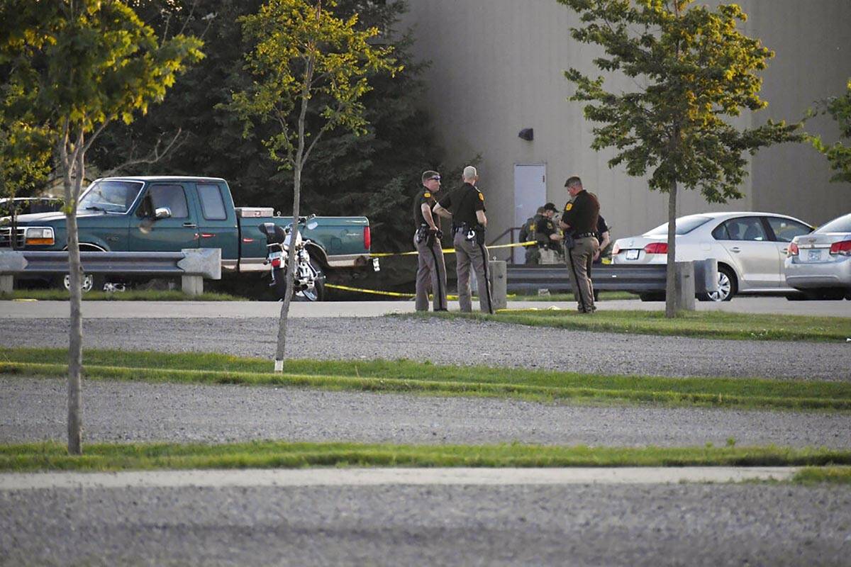 Troopers from the Iowa State Patrol stand outside Cornerstone Church after a shooting on Thursd ...