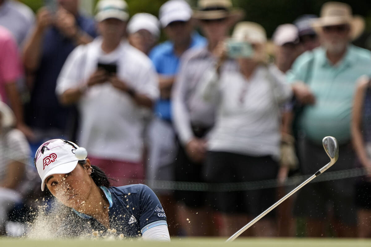 Danielle Kang hits out of the bunker on the 18th hole during the second round of the U.S. Women ...